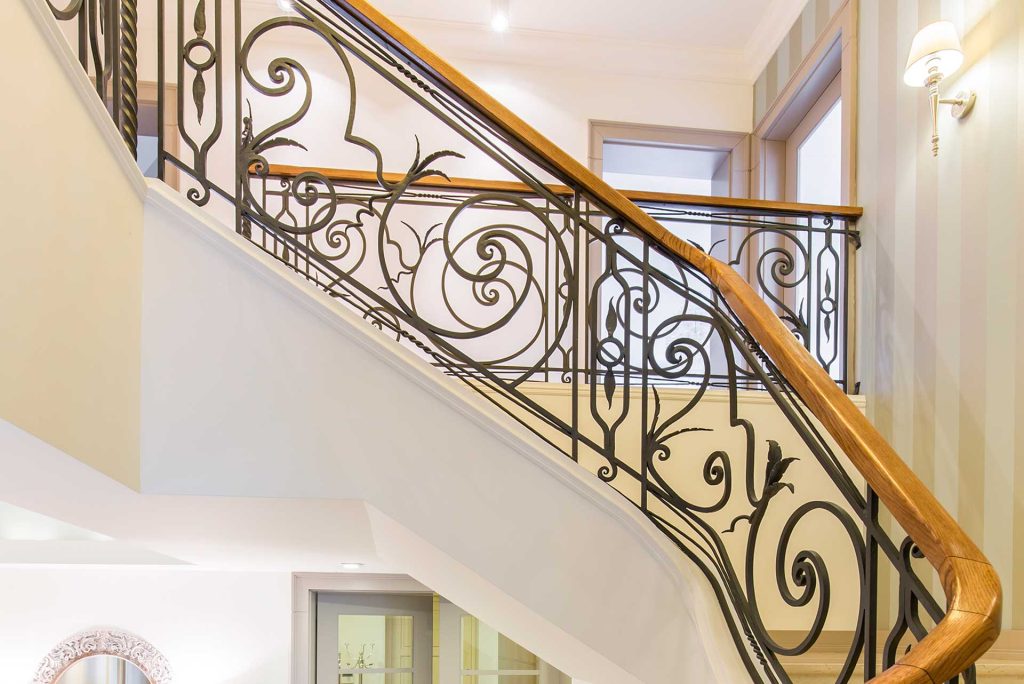 An elegant, custom-welded stair railing in a modern home